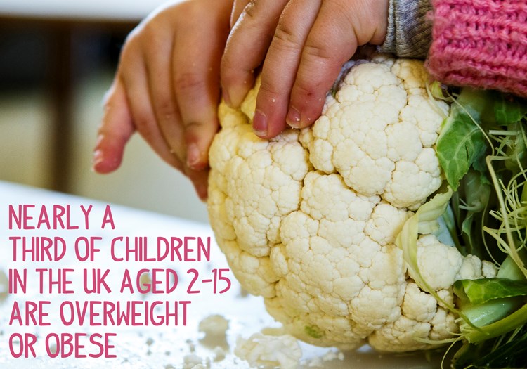 child taking apart a cauliflower