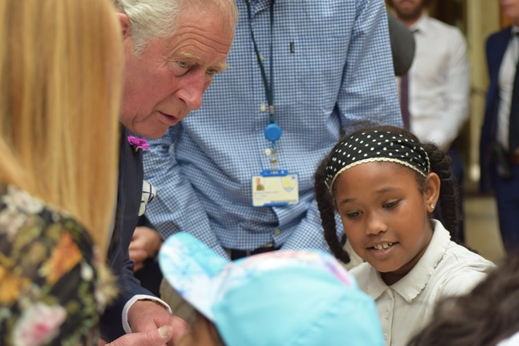 Prince Charles speaking to children at event