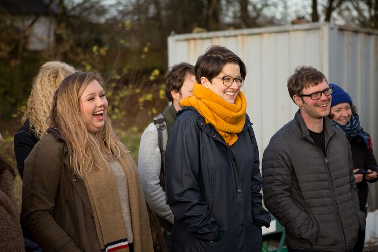 crowd of happy people on a farm walk