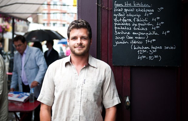 Tom Hunt outside in a food market