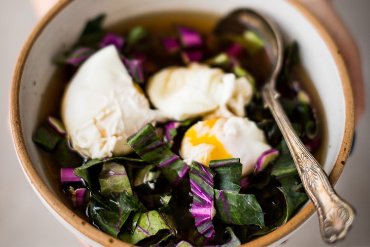 served portion of eggs in beef bone broth