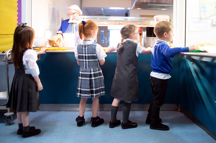 children getting their school meal