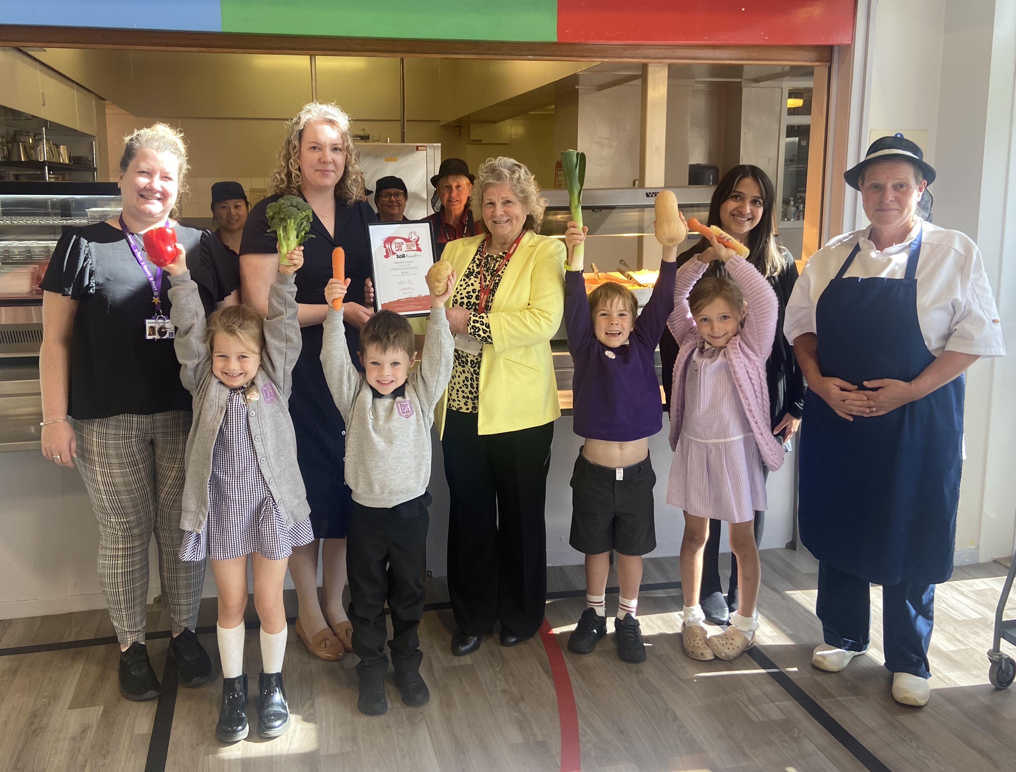 Councillor Dianne Alexander receives the Food for Life Served Here Bronze award certificate from Lucy MacLellan at Lasswade Primary School, Midlothian.jpeg