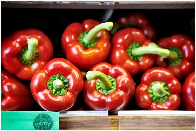 organic peppers on a shelf
