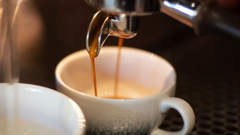 Fresh coffee pouring from a machine