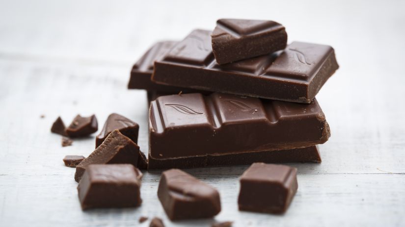 A stack of broken pieces of dark chcocolate