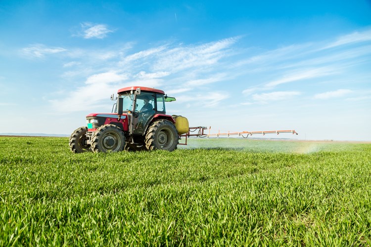 tractor spraying pesticide