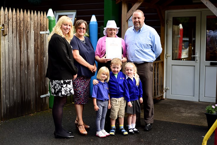 Staff and children from Giggles Private Day Nursery receive their award from Caron Longden, Catering Mark Development Manager (second left). Furthest left Caroline (Nursery Manager), and on the right, Jean (Nursery Chef ) and Mark Webster