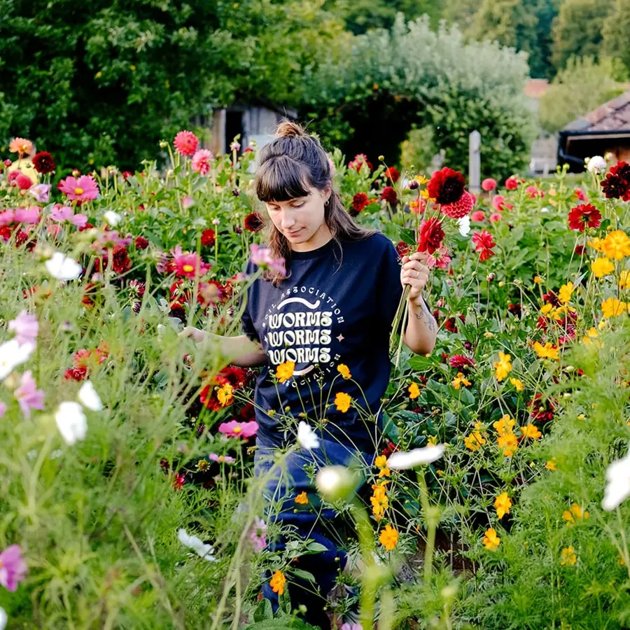 woman_in_soil_association_t-shirt_in_plants