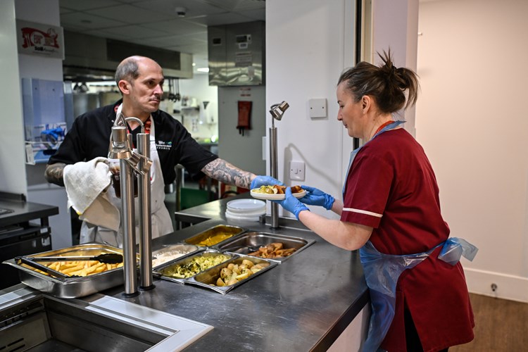Catering staff serving food