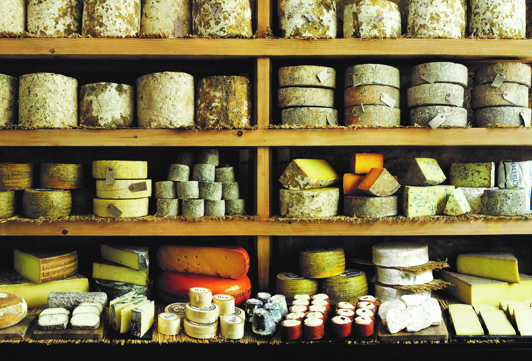 Shelves with a variety of cheeses
