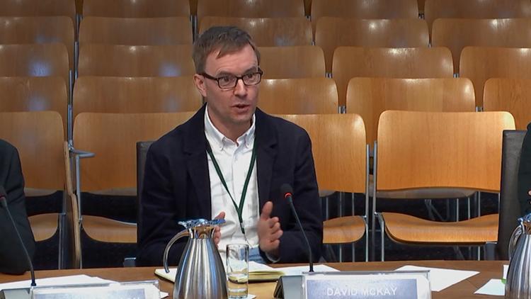 David McKay speaking into microphone at Scottish Parliament’s Rural Affairs and Islands (RAI) Committee.