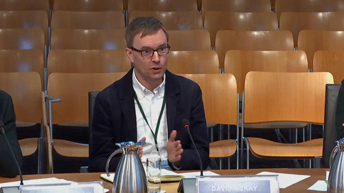 David McKay speaking into microphone at Scottish Parliament’s Rural Affairs and Islands (RAI) Committee.