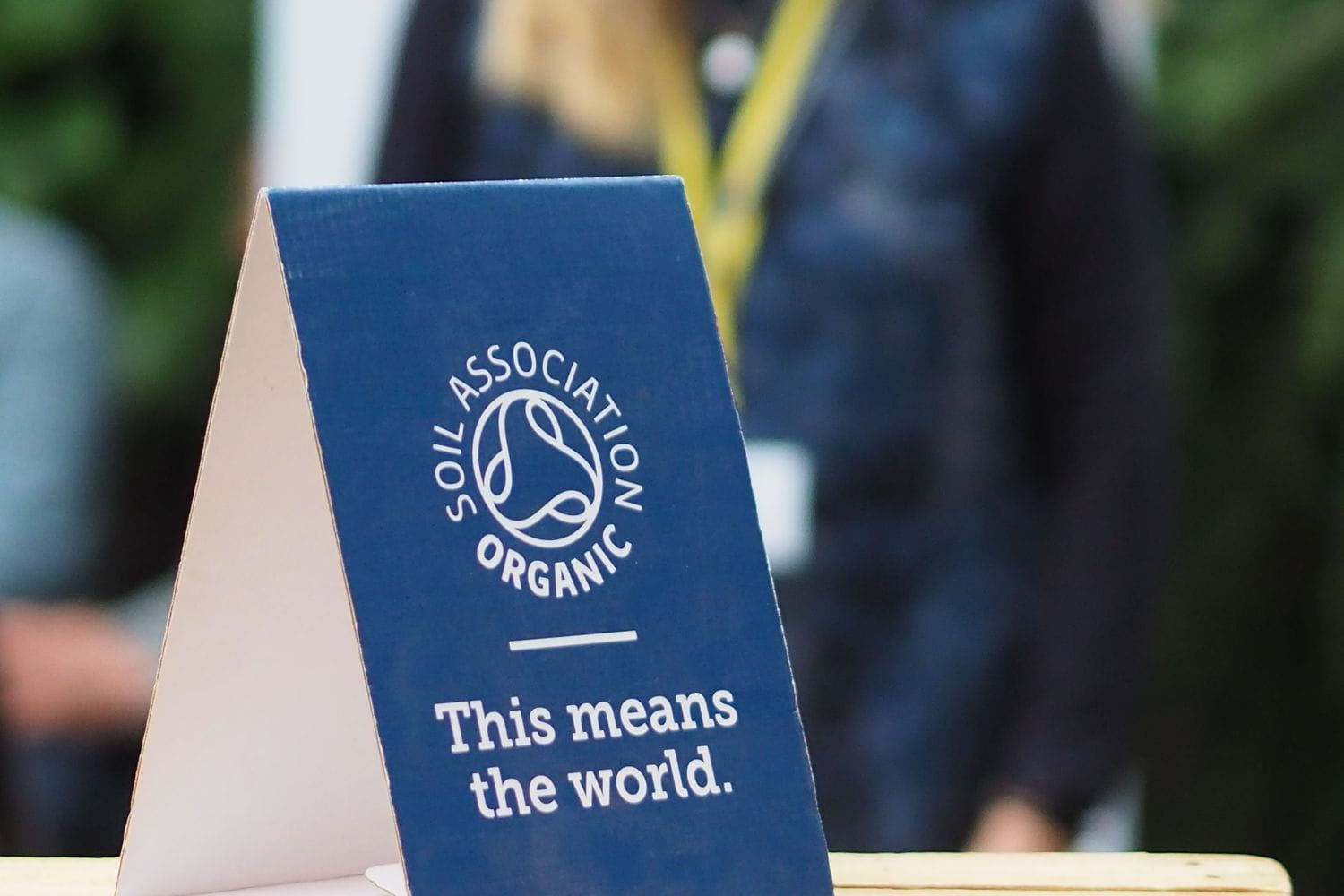 A Soil Association Certification organic branded placard at a conference