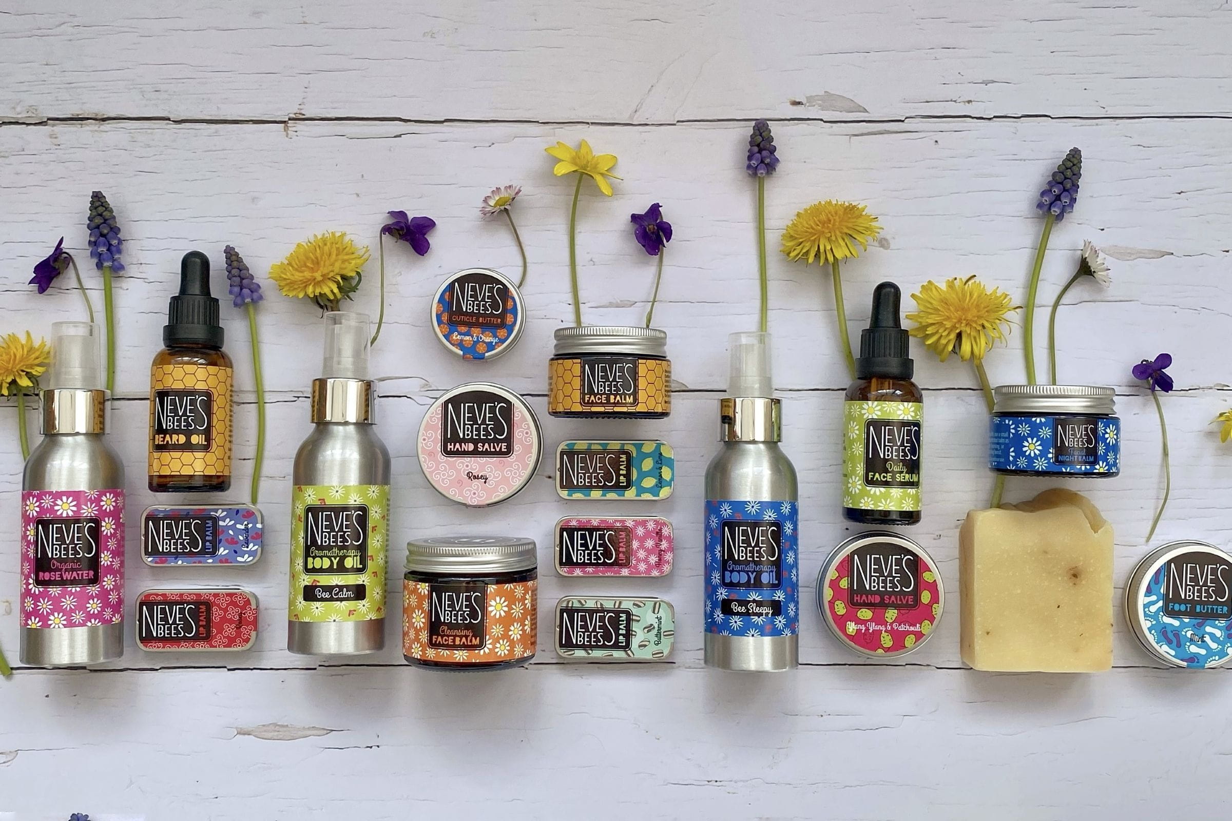 A huge selection of Neve's bees products including soaps, lip balms, and lotion in metal bottles