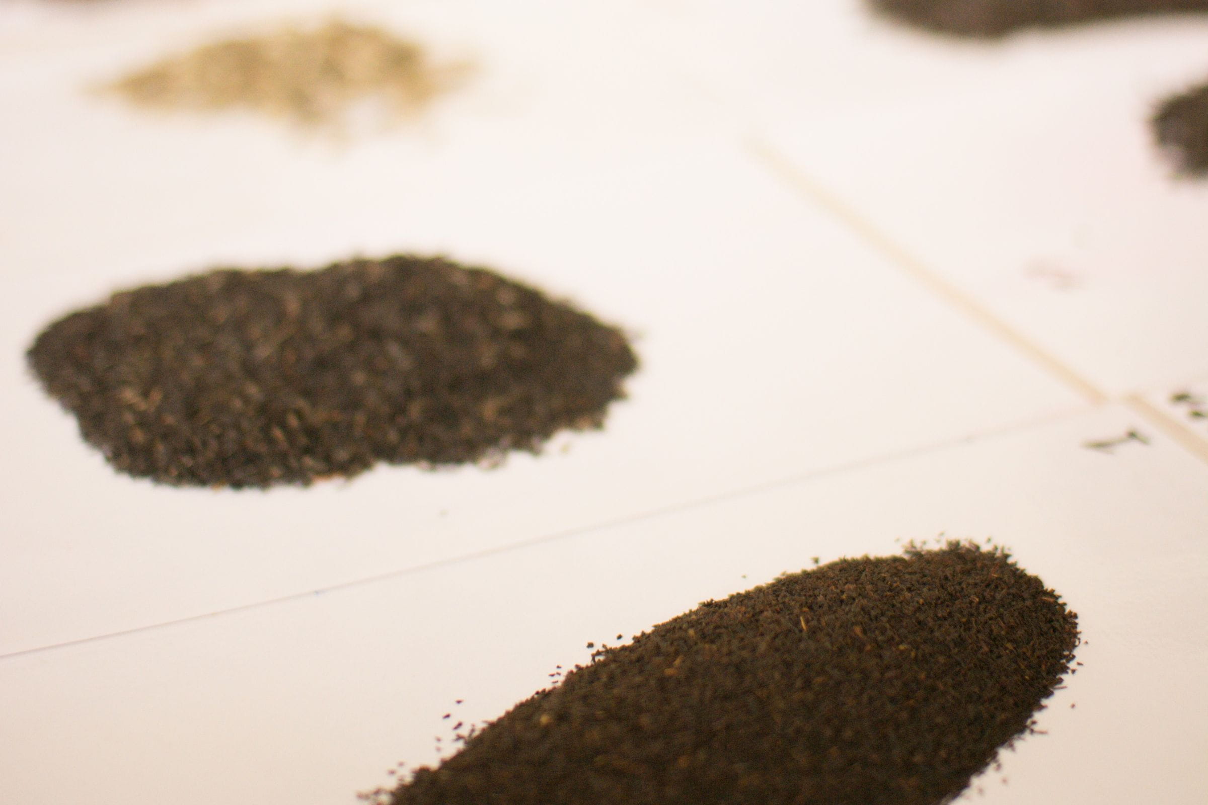 A selection of loose leaf teas laid out on paper
