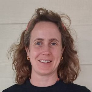 Smiling woman with wavy hair
