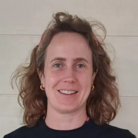 Smiling woman with wavy hair