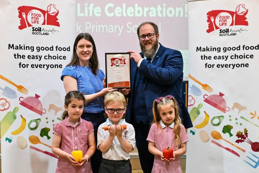 Food for Life Scotland Programme Manager Sarah Gowanlock presents the Food for Life Served Here Bronze certificate to Falkirk Council's Councillor Iain Sinclair