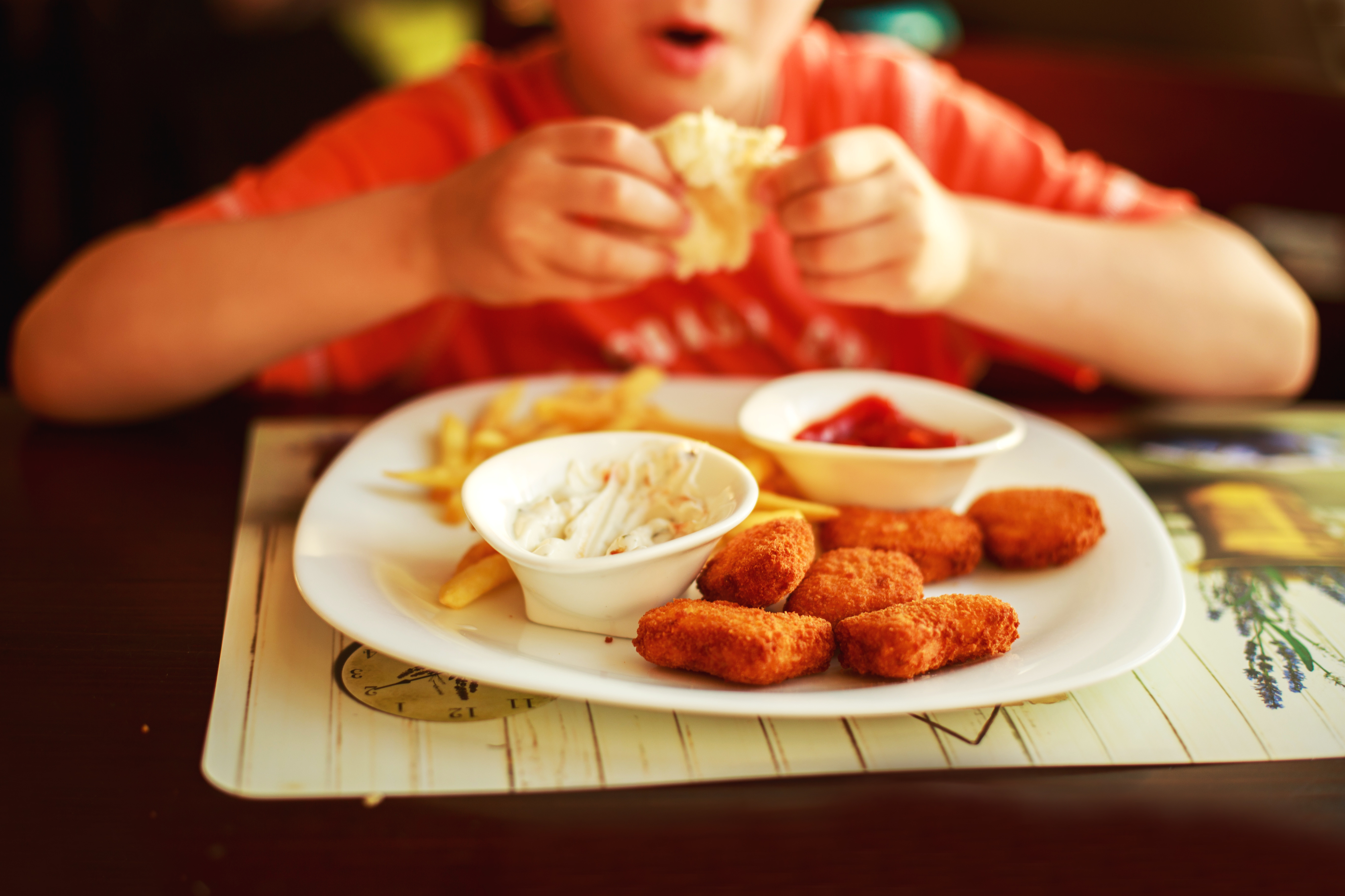 child-eating-chicken-nugg