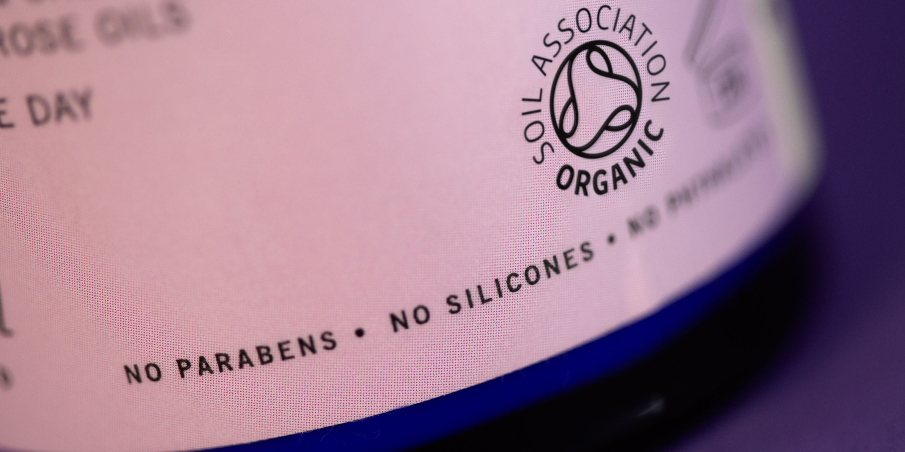 The Soil Association organic symbol on a cosmetic bottle which states no parabens and no silicones